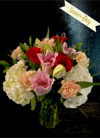 Roses, Lilies, Carnations and Hydrangeas in a vase.