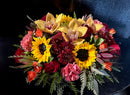 Fall mix centerpiece of sunflowers and premium blooms in autumn tones