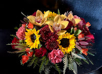 Fall mix centerpiece of sunflowers and premium blooms in autumn tones