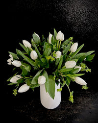 Tulip arrangement in a ceramic vase