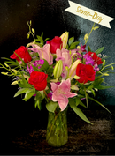 Lillies, roses and dendrobium in a vase.