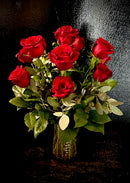 One dozen roses arranged in a vase